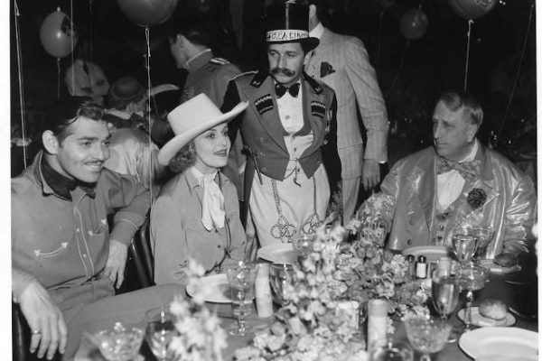 Hearst Castle was a gathering place for the old Hollywood elite in the 1920s and 1930s. Here's Clark Gable (far left), Carole Lombard, producer Mervyn LeRoy (standing) and W.R. Hearst (seated, far right) at the famous circus party in 1938. Credit: http://www.oldhollywoodfilms.com/